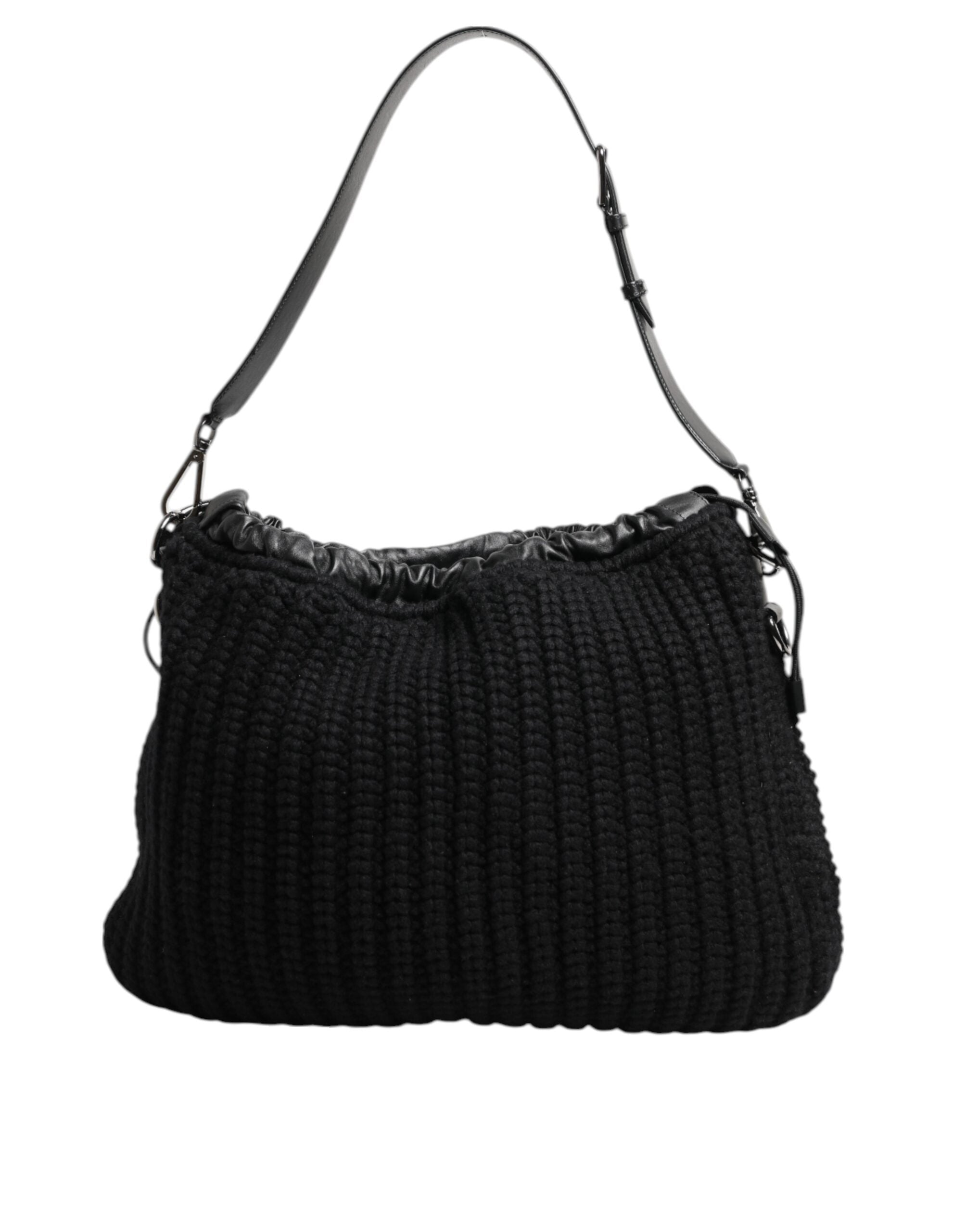 Sac à main femme Dolce & Gabbana en cachemire noir, avec détails en cuir tissé, porté sur l'épaule.