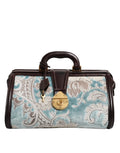 Sac à main de voyage en cuir floral jacquard bleu et marron Dolce & Gabbana, avec poignées et détails élégants.