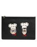 Pochette homme Dolce & Gabbana en cuir noir avec embellissements, sacoche élégante et sophistiquée.