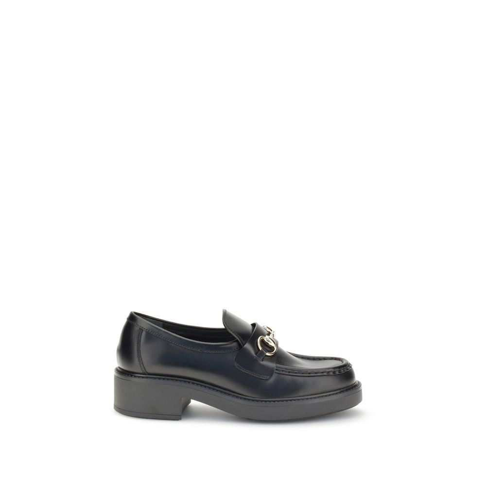 Mocassins Gucci en cuir de veau noir Bos Taurus, slip-on élégants pour homme, avec finition de haute qualité.