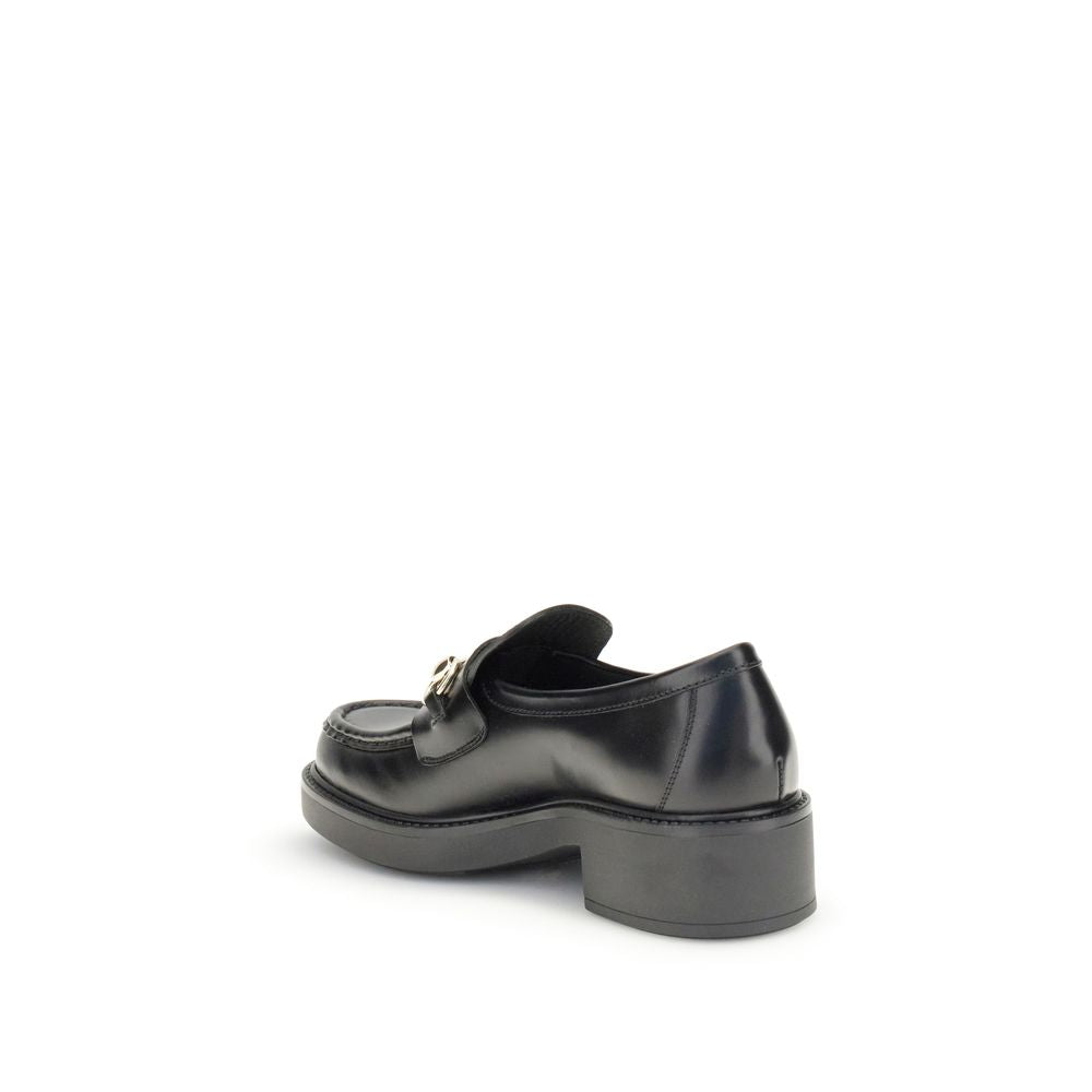Chaussures Gucci en cuir de veau noir Bos Taurus, mocassins à enfiler élégants pour homme.