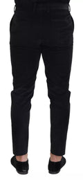 Pantalon chino slim en coton stretch noir de Dolce & Gabbana, vue de face, détail de la coupe ajustée et de la texture du tissu.