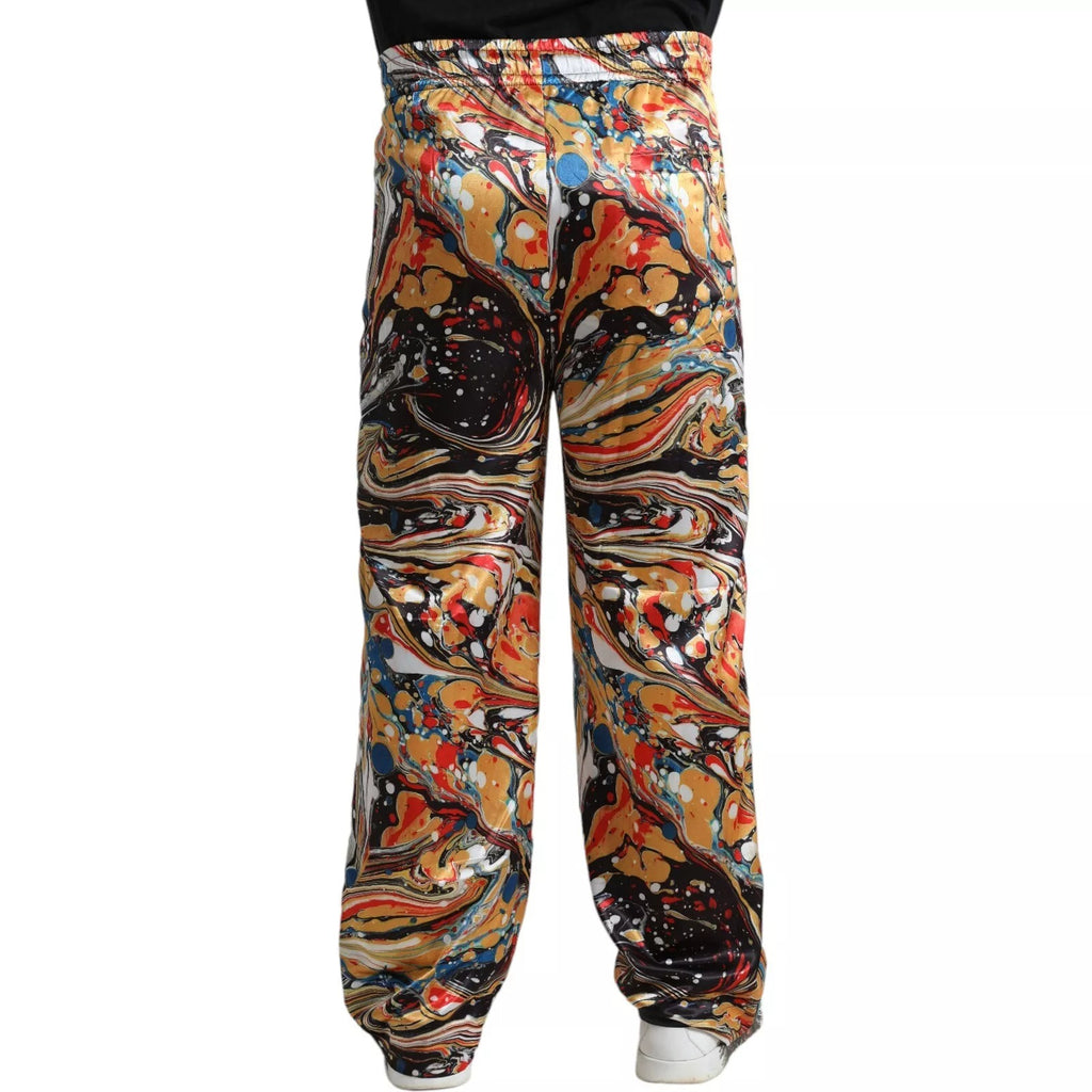 Pantalon satin Dolce & Gabbana à motif marbre multicolore, style élégant et tendance, vue de face sur fond neutre
