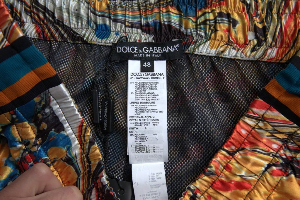 Pantalon en satin à motif marbre multicolore de Dolce & Gabbana, style élégant et tendance.