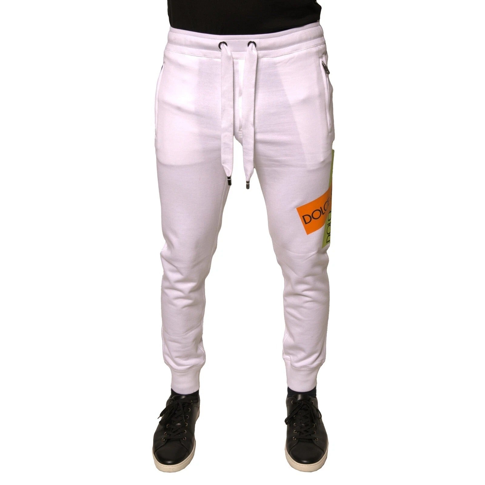 Pantalon jogging blanc Dolce & Gabbana en coton avec bande logo, style décontracté et confortable, vue de face.