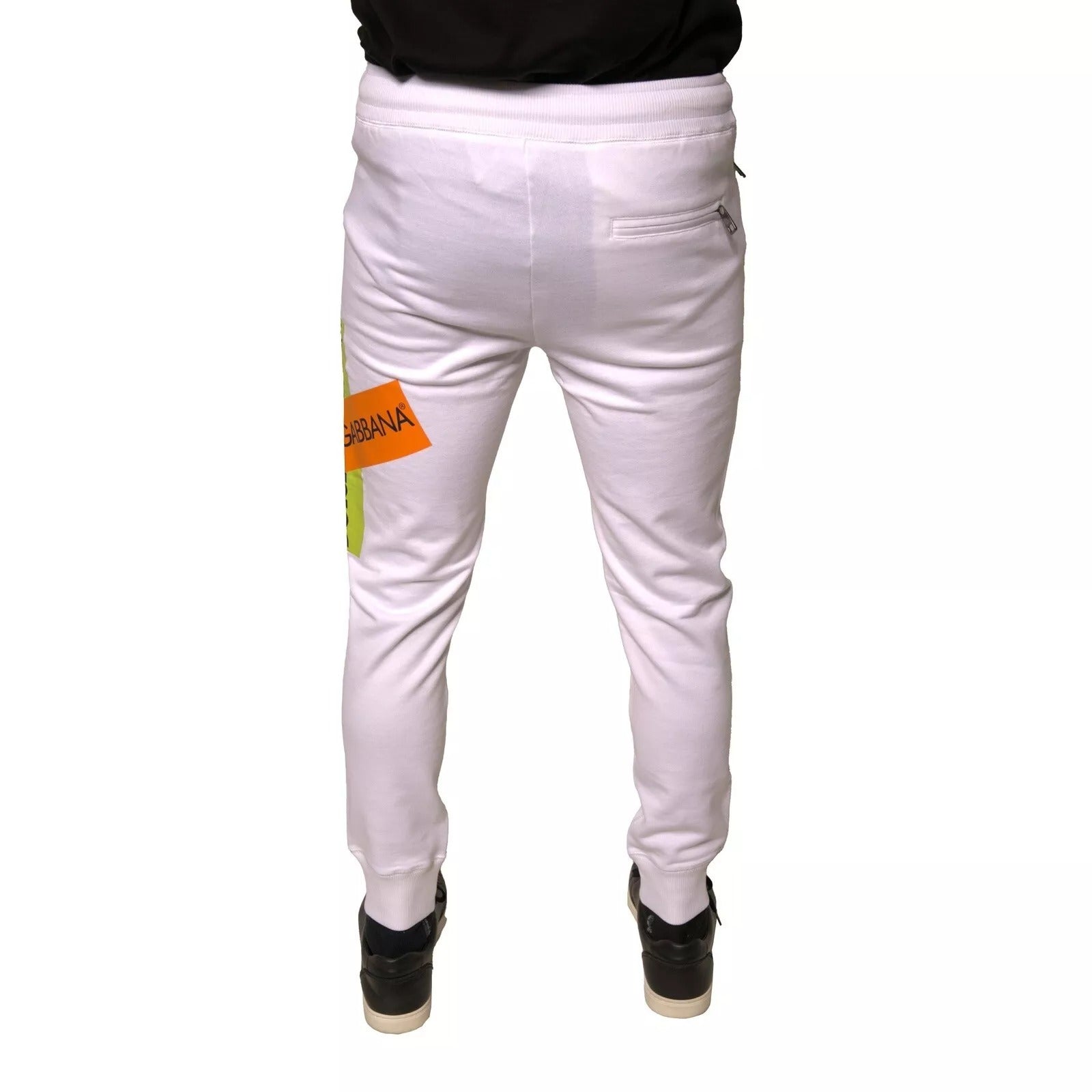 Pantalon jogger blanc en coton Dolce & Gabbana avec bande logo, style décontracté et élastiques à la taille et aux chevilles.
