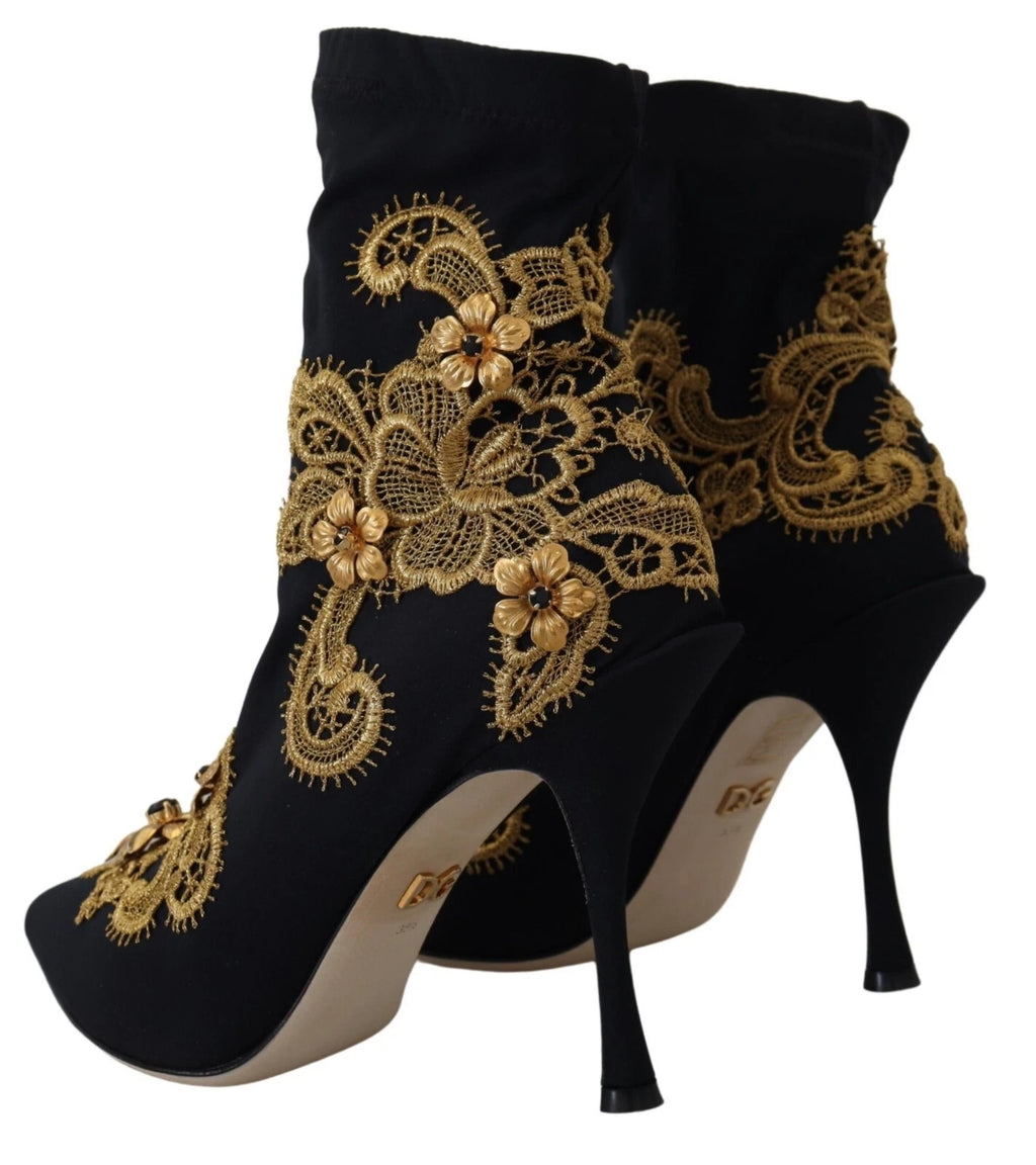 Bottes noires Dolce & Gabbana avec broderies or, cristaux et design élégant, vue de face sur fond neutre.