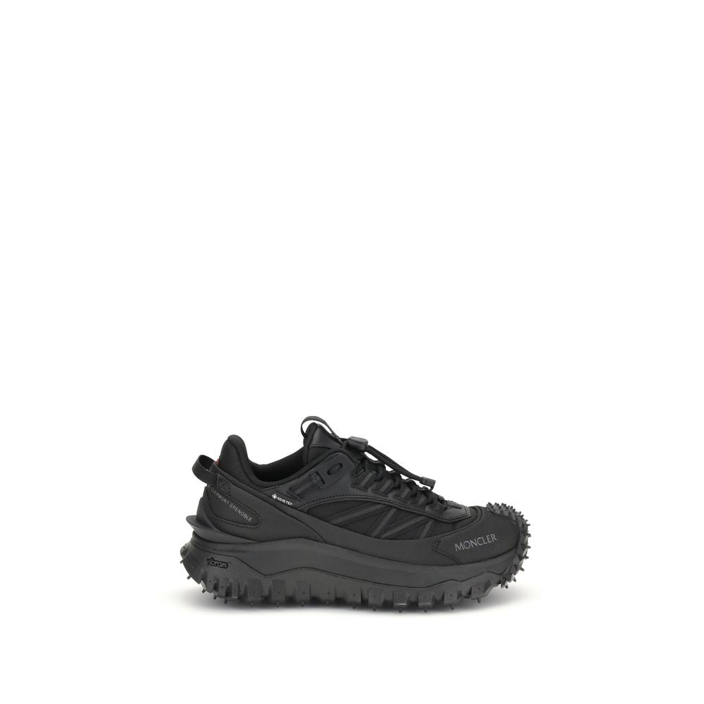 Sneakers athlétiques Moncler Bos Taurus en cuir de veau noir, style sportif et moderne.