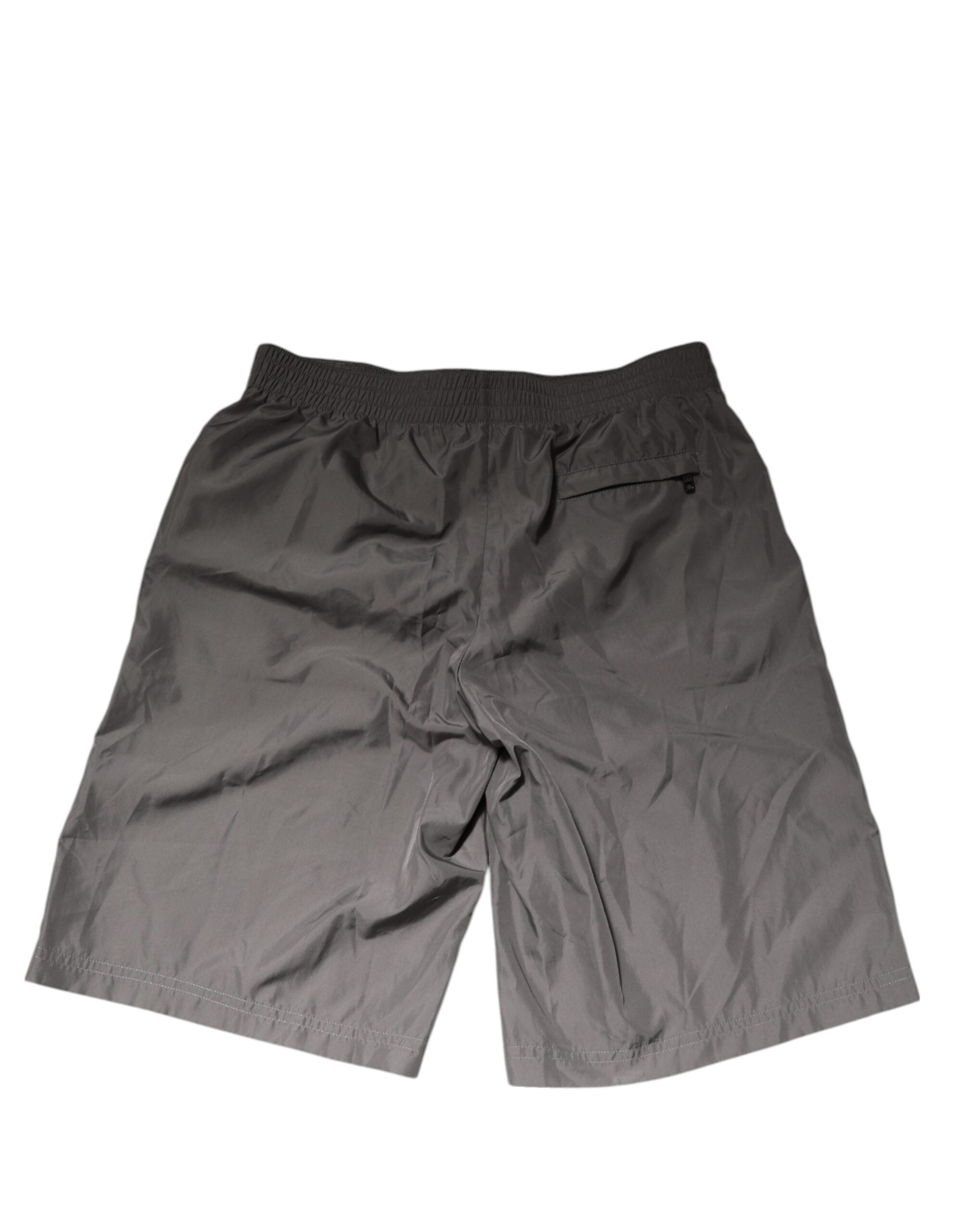 Shorts de bain en nylon gris clair Dolce & Gabbana avec taille élastique et design léger, parfaits pour la plage.