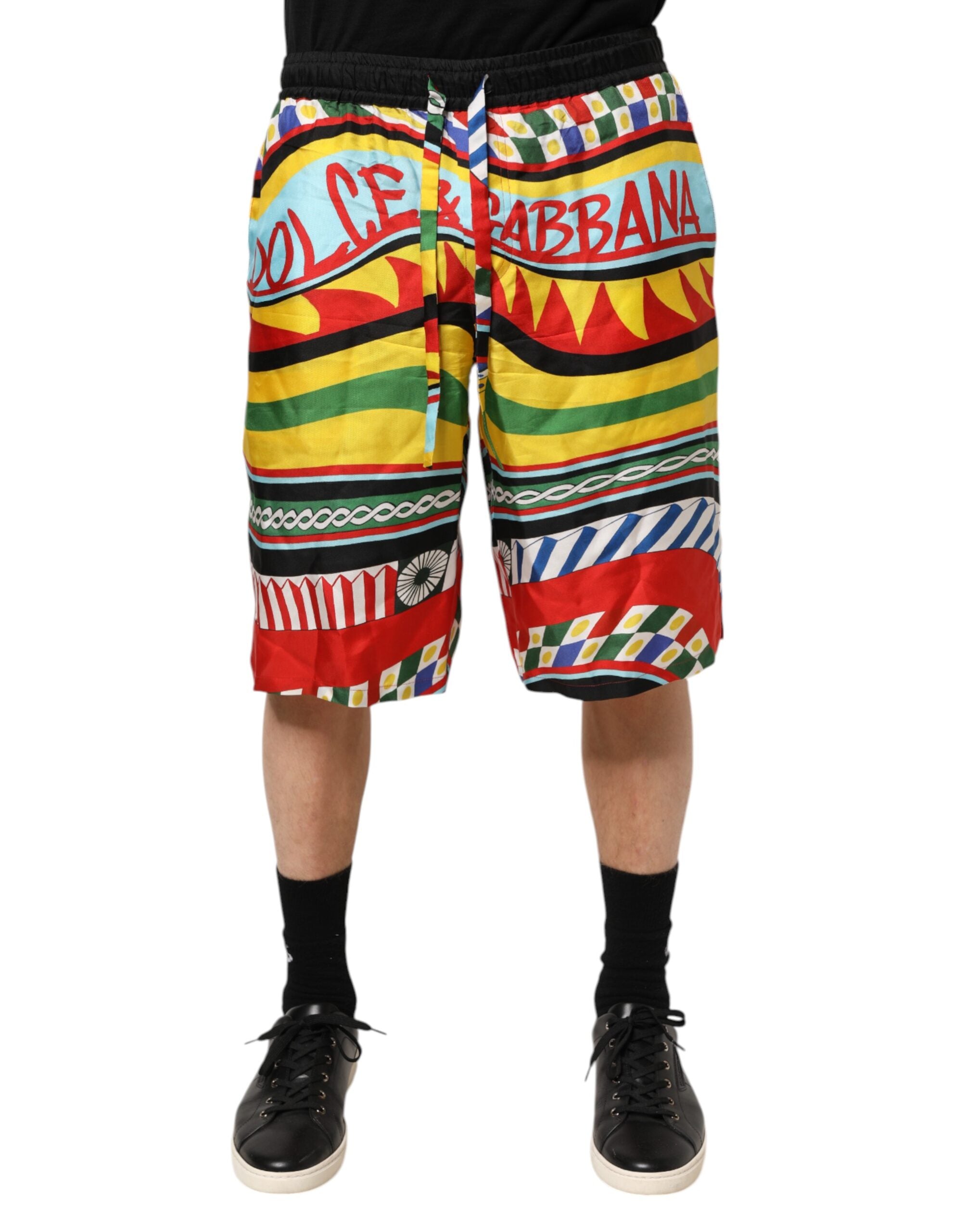 Shorts de bain Dolce & Gabbana Sicilian Carretto multicolores avec motifs méditerranéens, élégants et colorés.