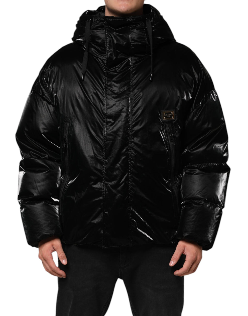 Veste matelassée noire à capuche avec logo Dolce & Gabbana et fermeture éclair complète, vue de face.
