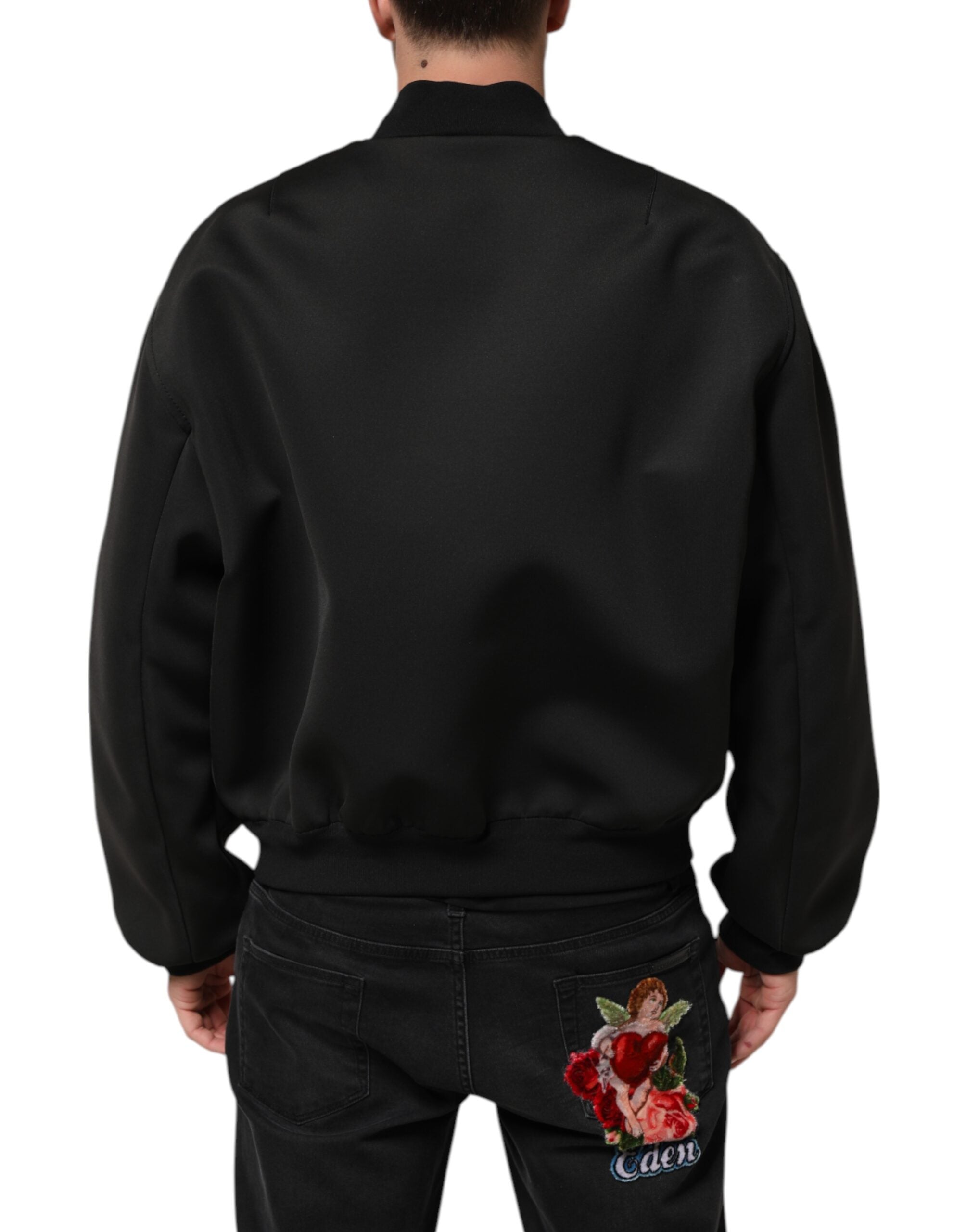 Veste bomber noire en polyester avec logo Dolce & Gabbana, plaque à l'avant, style élégant et moderne.