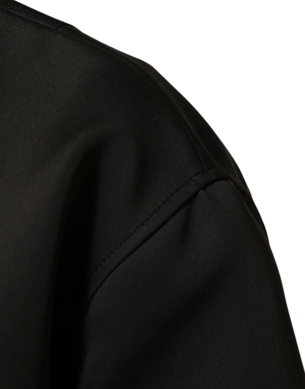 Veste bomber noire en polyester Dolce & Gabbana avec plaque logo, coupe moderne et détails élégants.