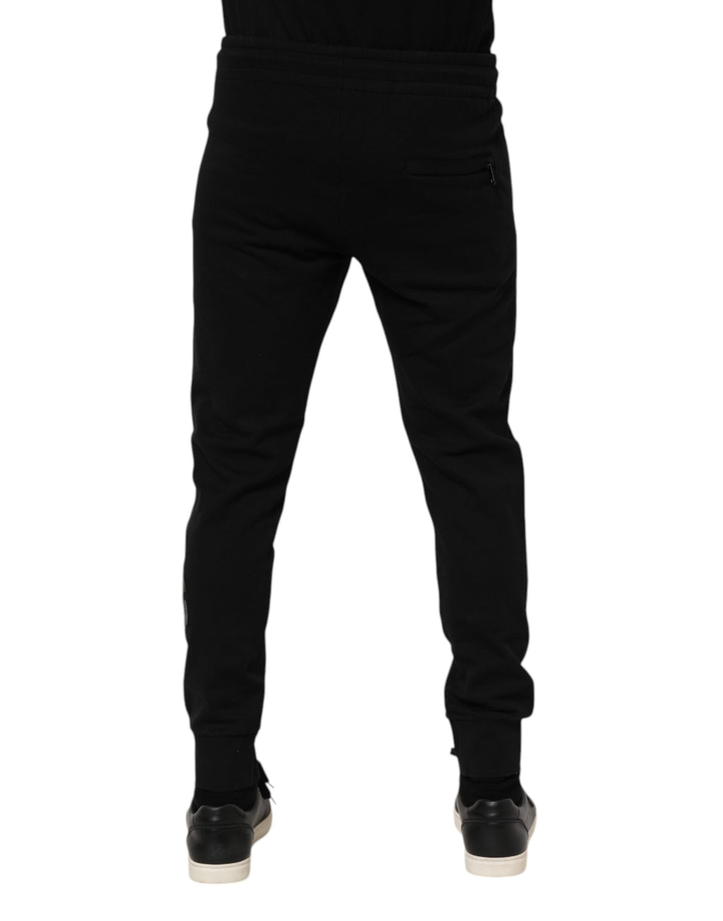Pantalon jogging noir en coton Dolce & Gabbana pour homme, style décontracté avec ceinture élastique et poches latérales.