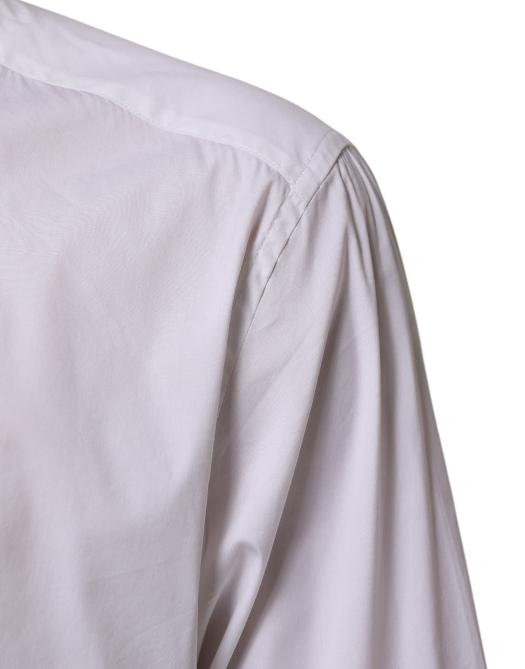 Chemise formelle en coton blanc Dolce & Gabbana avec manches longues et détails dorés, élégante et sophistiquée.