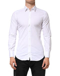 Chemise homme Dolce & Gabbana blanche à manches longues en coton avec détails dorés, élégante et sophistiquée.