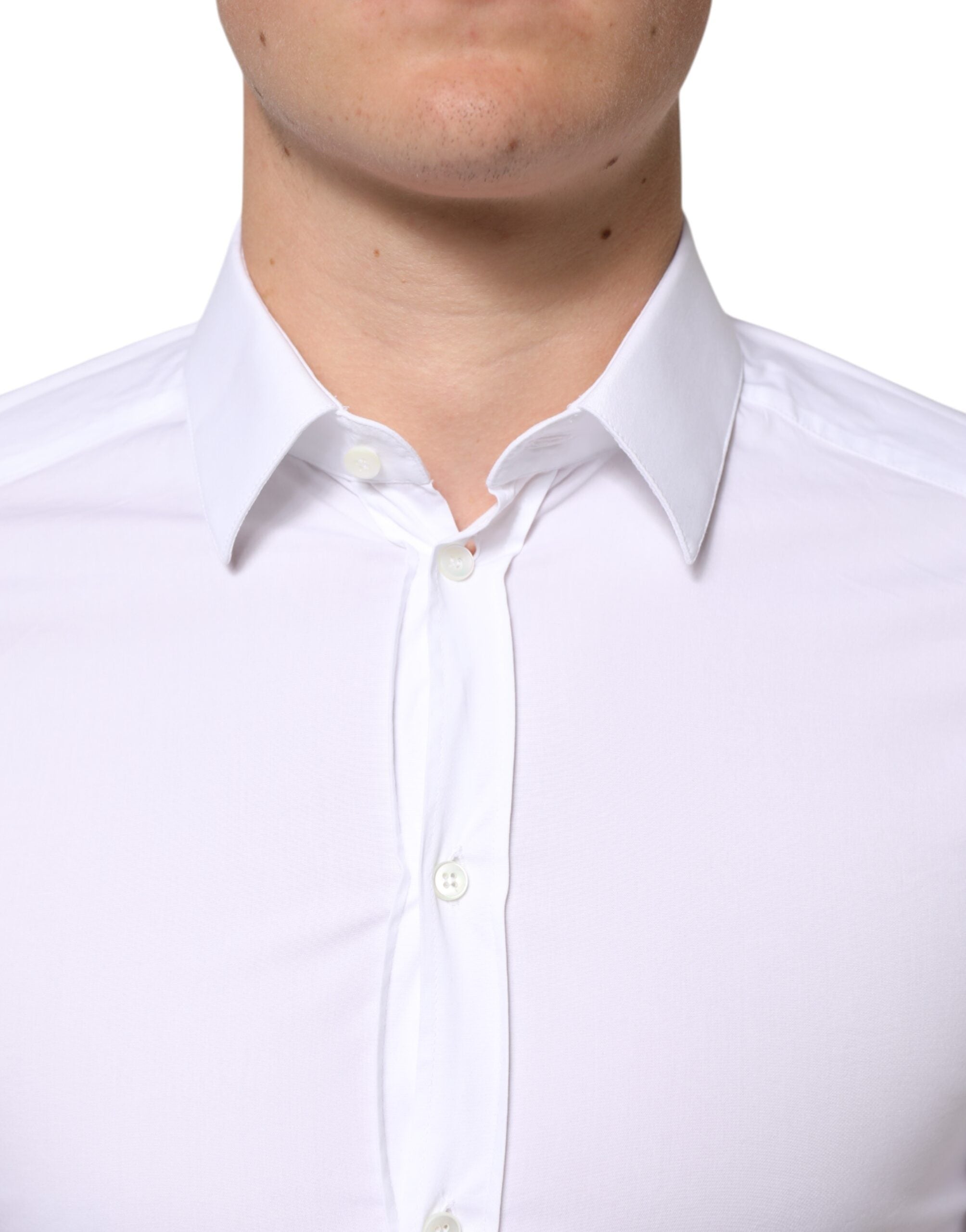 Chemise homme Dolce & Gabbana en coton blanc à manches longues avec détails dorés, élégante et sophistiquée.