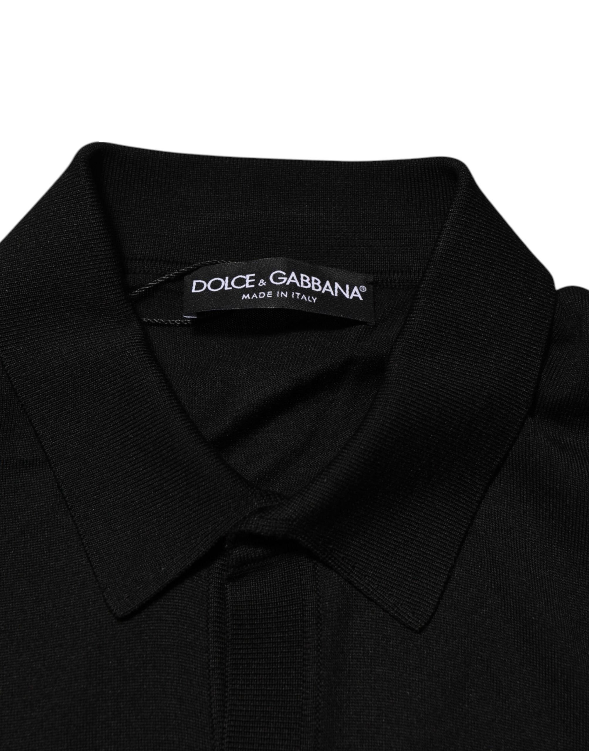 Pull léger en soie noire Dolce & Gabbana avec boutons, style élégant et sophistiqué, visible en détail dans l'image.