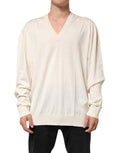 Pull en laine vierge ivoire pour homme Dolce & Gabbana avec col en V, porté sur un mannequin.