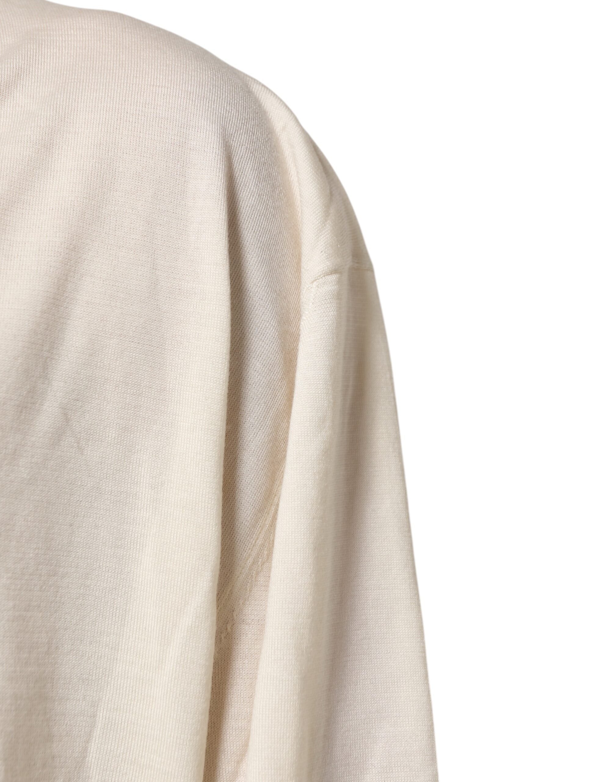 Pull homme en laine vierge ivoire Dolce & Gabbana, pull en V, tricot fin et élégant, visible en détail sur l'image.