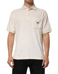 Polo homme Dolce & Gabbana en coton ivoire avec logo, poche à la poitrine, style décontracté et élégant.
