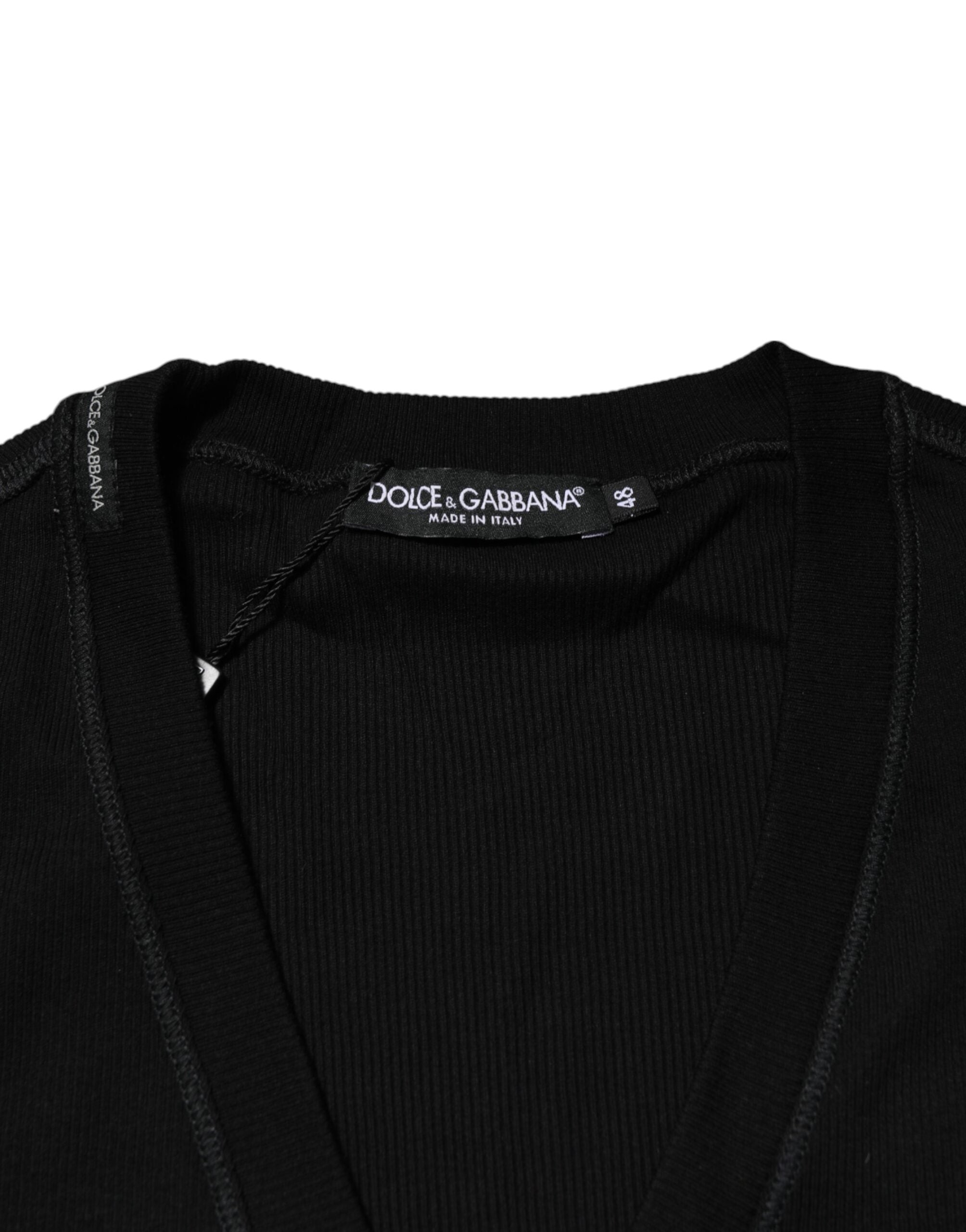 Pull homme Dolce & Gabbana en coton noir à boutons, cardigan élégant avec col classique, porté sur un mannequin.