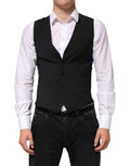 Veste homme Dolce & Gabbana en laine noire, élégante, ajustée, avec col en V et fermeture à boutons pour un style formel.
