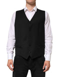 Gilet homme en laine noire Dolce & Gabbana, vêtement formel élégant avec col et fermeture à boutons.