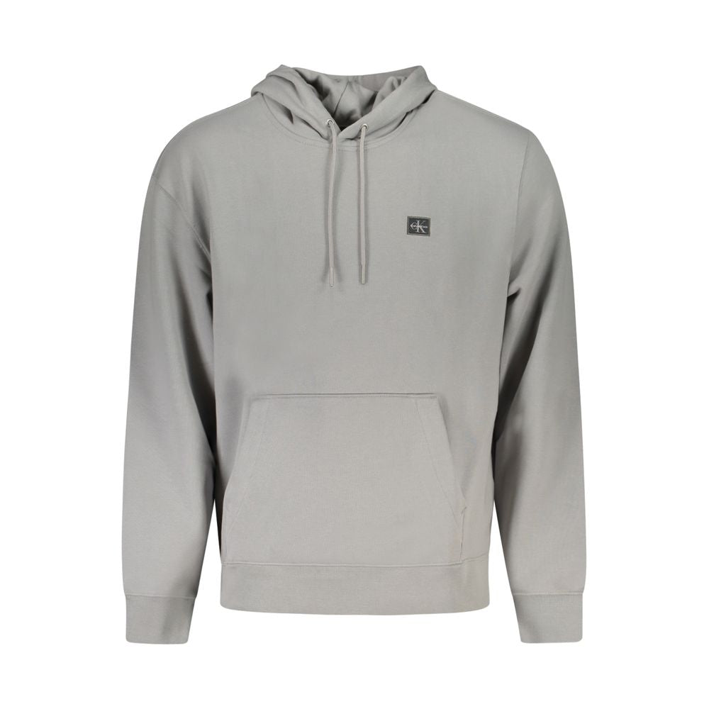 Sweatshirt gris en coton pour homme de la marque Calvin Klein, à col rond et manches longues, vue de face.