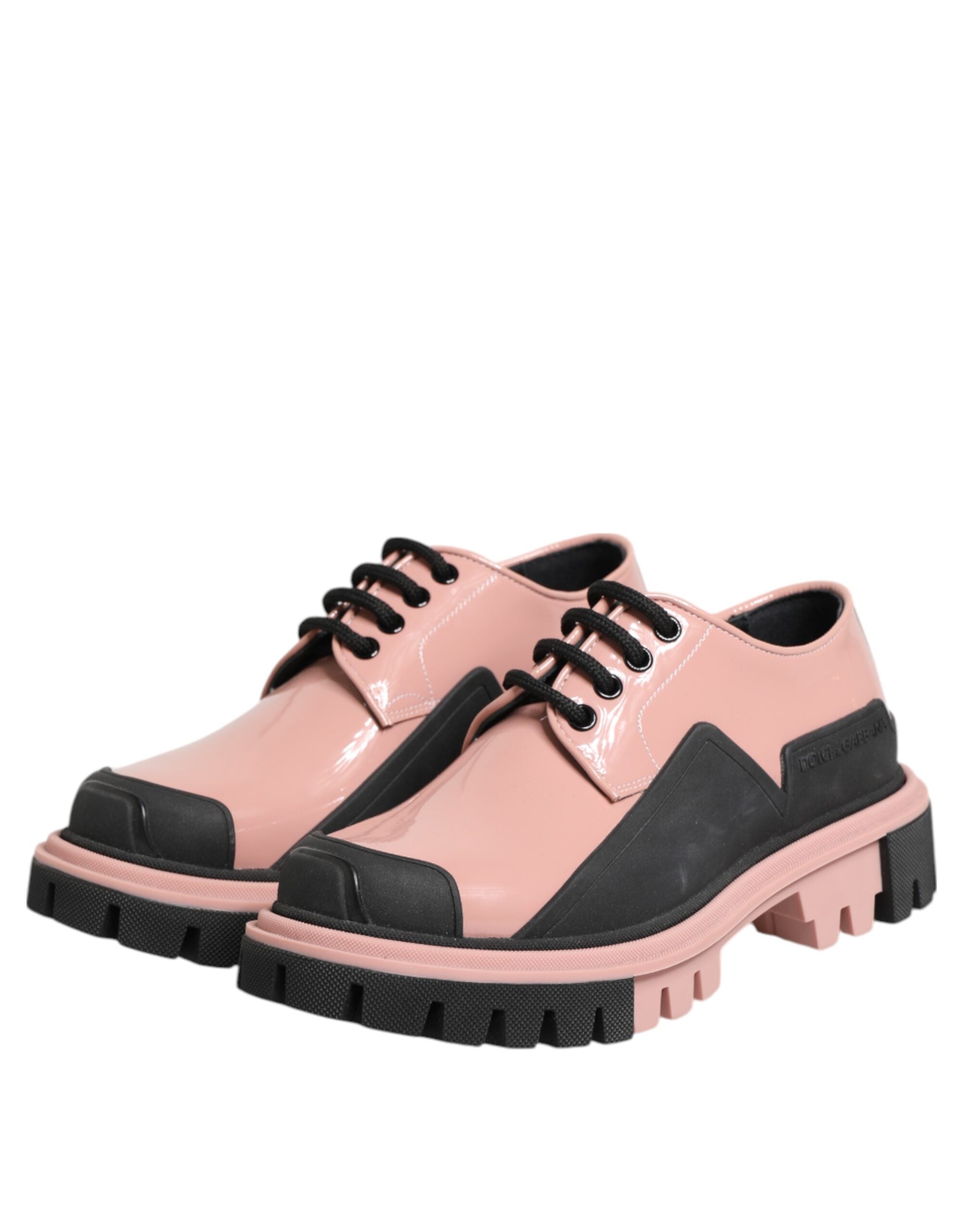 Chaussures en cuir noir et rose poudre Dolce & Gabbana à lacets, élégantes et tendance.