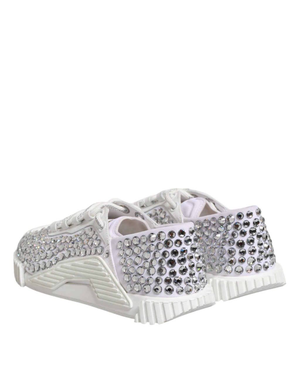 Sneakers blanches Dolce & Gabbana NS1 en toile et cuir, ornées de détails embellis, visibles sur cette image.