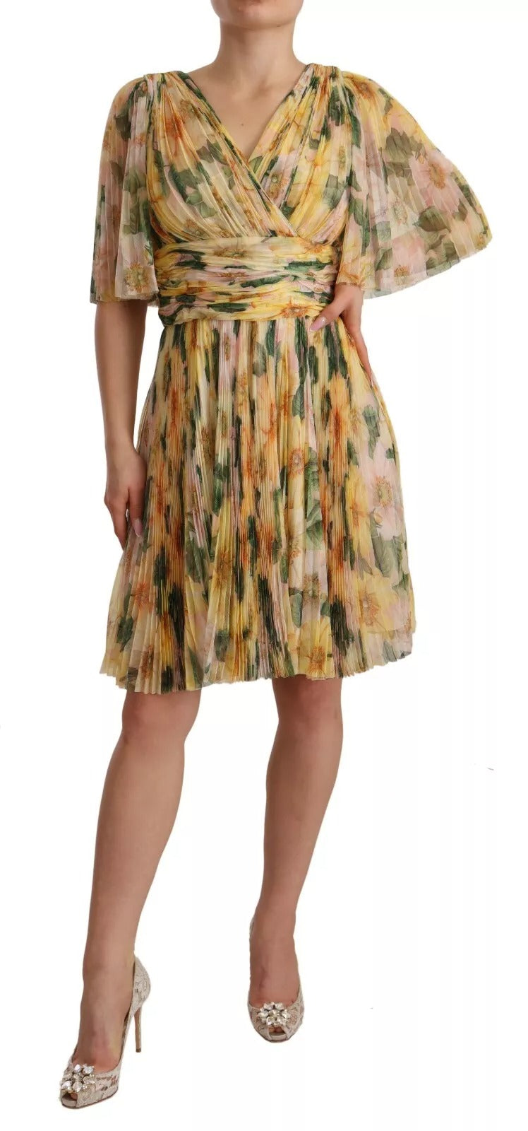 Robe longue plissée à imprimé floral jaune de Dolce & Gabbana, élégante et sophistiquée, pour un style féminin.