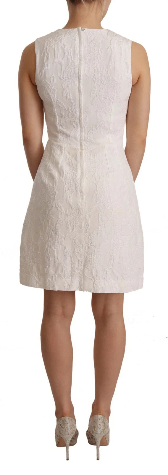 Robe courte sans manches Dolce & Gabbana blanche avec imprimé floral, style robe de sheath élégante et féminine.