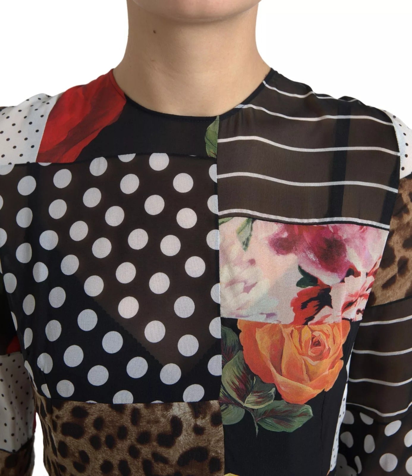 Robe Dolce & Gabbana à patchwork multicolore avec motifs floraux et léopard, détails colorés et élégants.