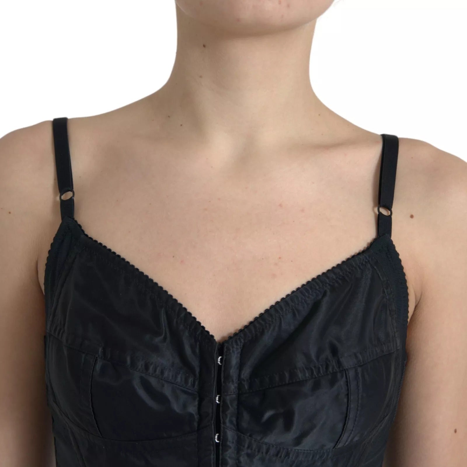Robe mini noire en nylon avec corset ajusté de Dolce & Gabbana, silhouette moulante et détails sophistiqués.
