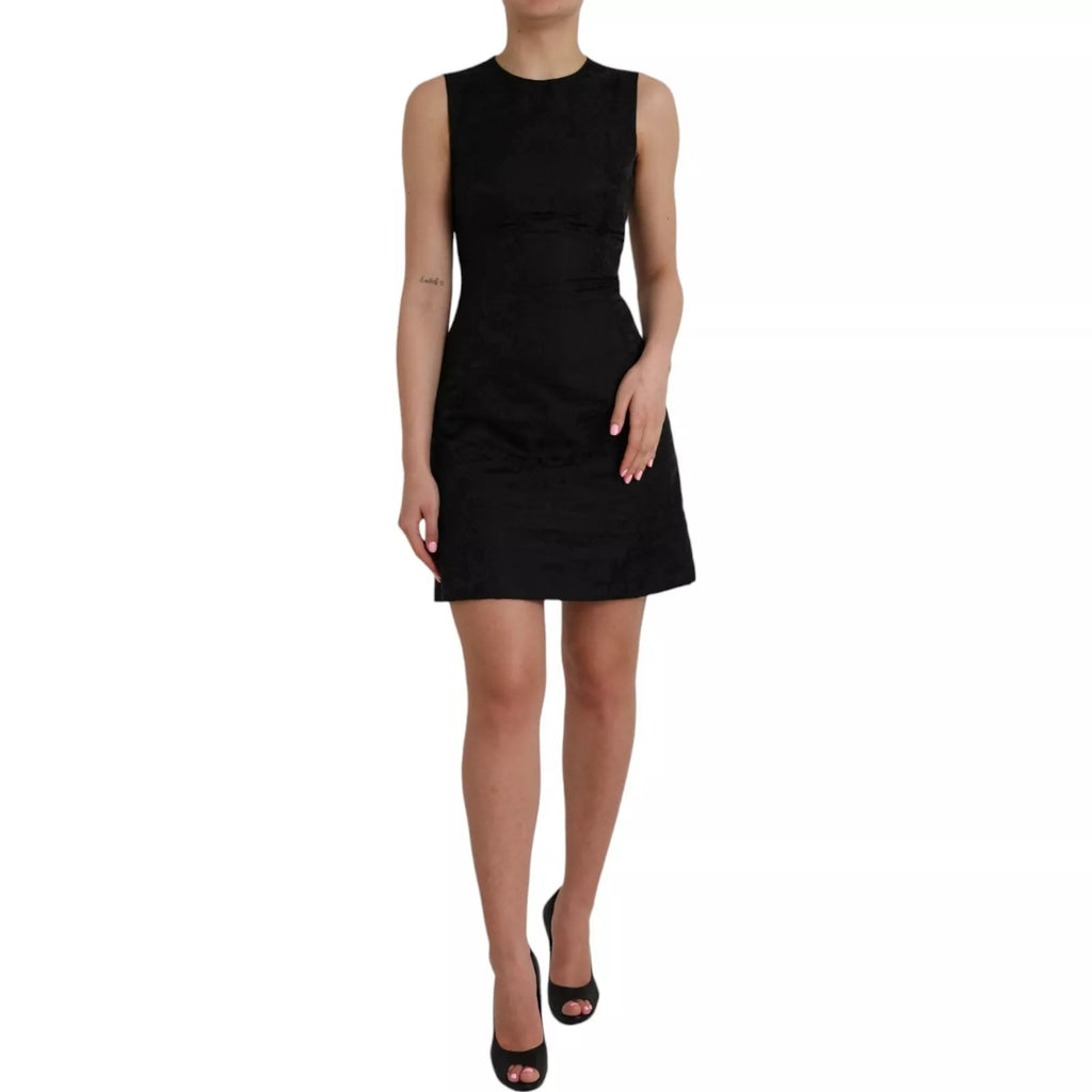 Robe noire sans manches Dolce & Gabbana, coupe moulante et forme A-line, mini longueur, tissu élégant et sophistiqué.