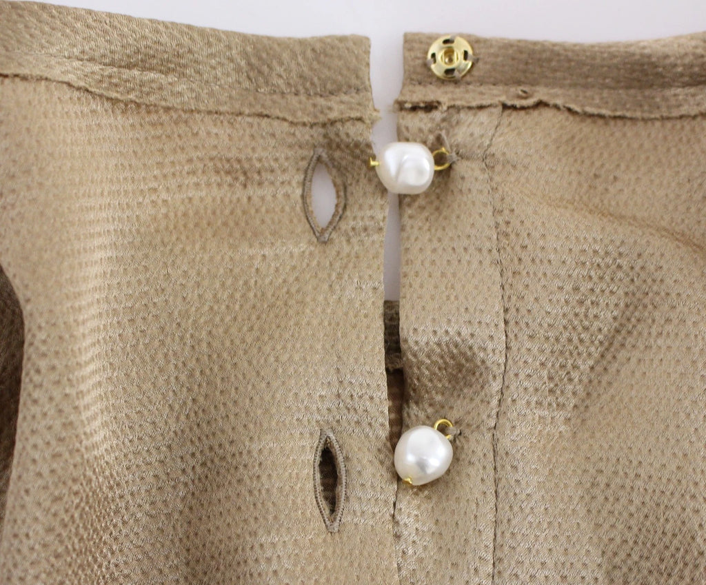 Blouse Dolce & Gabbana en cristal doré, pièce spéciale de la collection runway, avec détails élégants et finition raffinée.