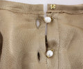 Blouse Dolce & Gabbana en cristal doré, pièce spéciale de la collection runway, avec détails élégants et finition raffinée.