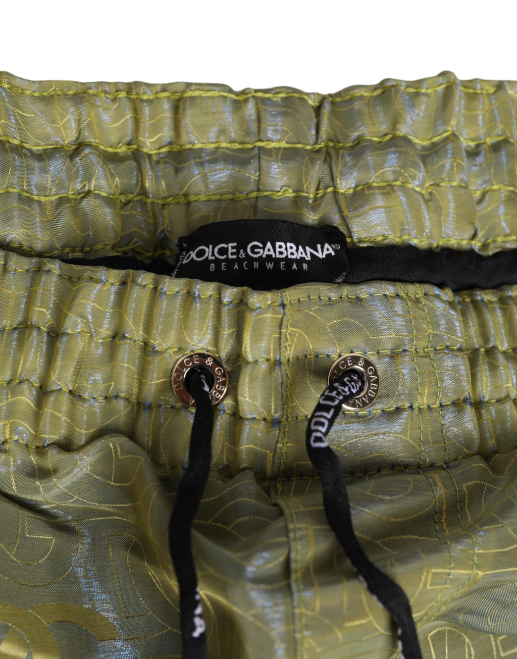 Maillot de bain homme Dolce & Gabbana en polyester vert avec logo métallique et imprimé brillant.