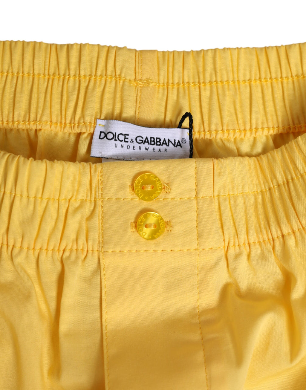 Maillot de bain court en coton jaune de Dolce & Gabbana avec taille élastique et style estival.