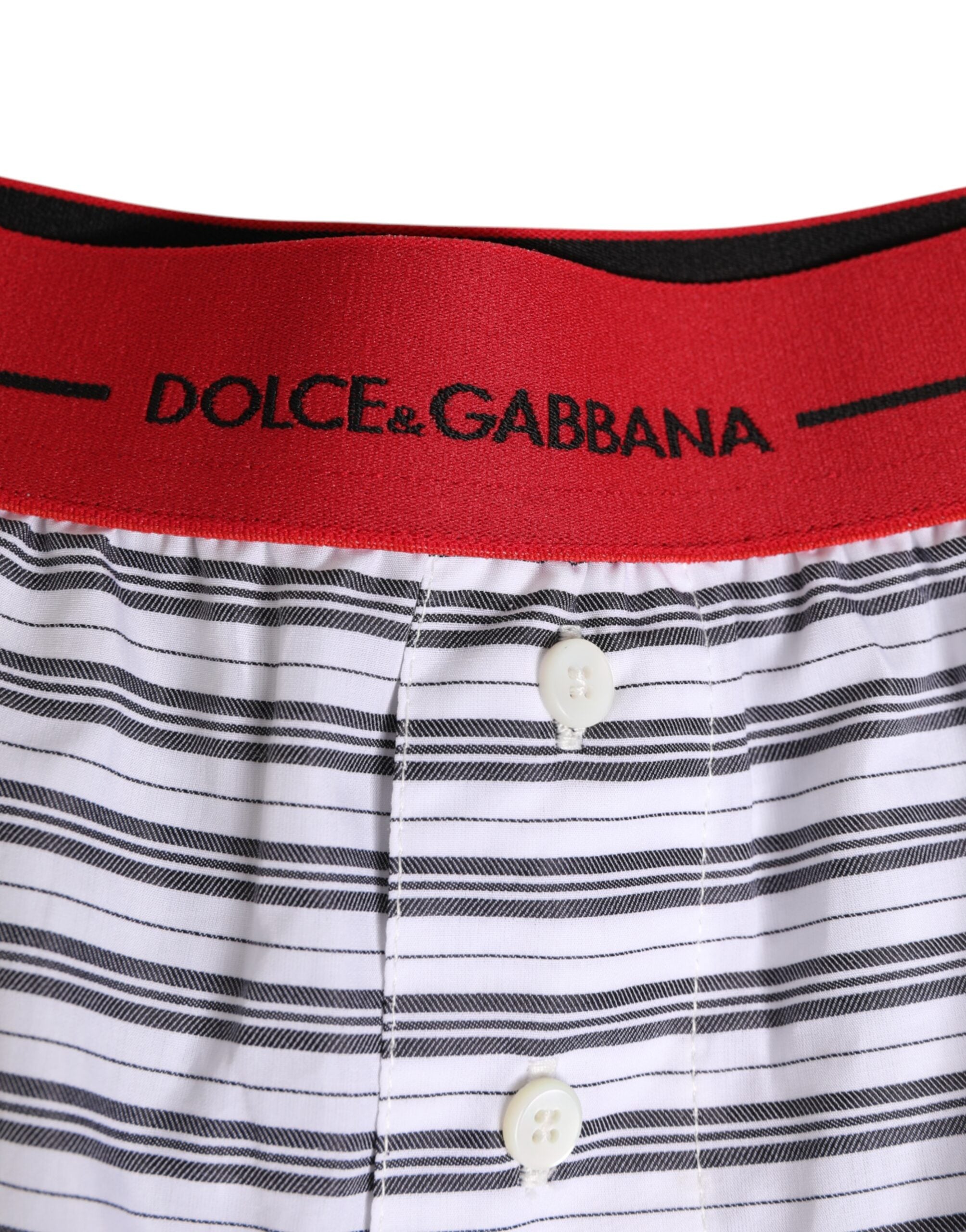 Shorts de bain en coton blanc à rayures avec ceinture rouge de Dolce & Gabbana, style élégant et confortable.