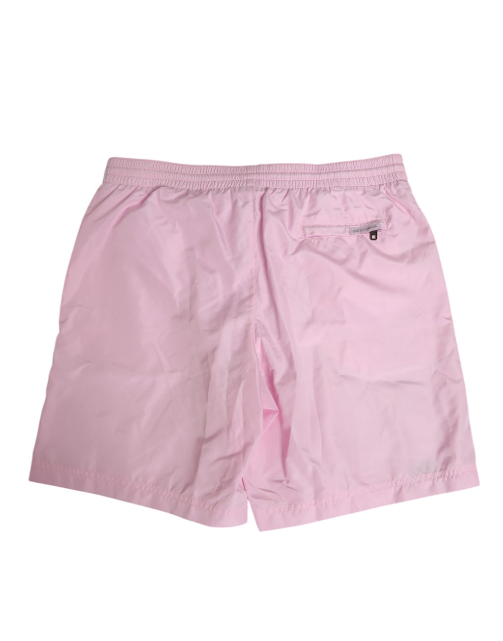 Maillot de bain homme Dolce & Gabbana en nylon rose avec logo et bandes latérales, style beachwear élégant.