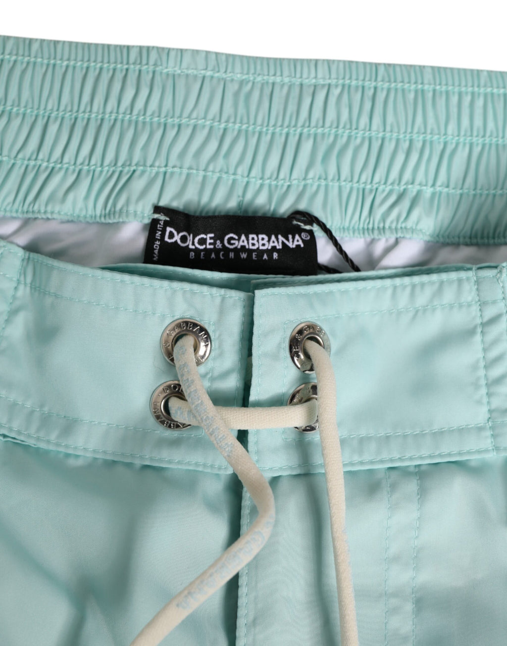 Shorts de bain homme Dolce & Gabbana en polyester bleu aqua, vêtement de plage pour la baignade et les activités nautiques.