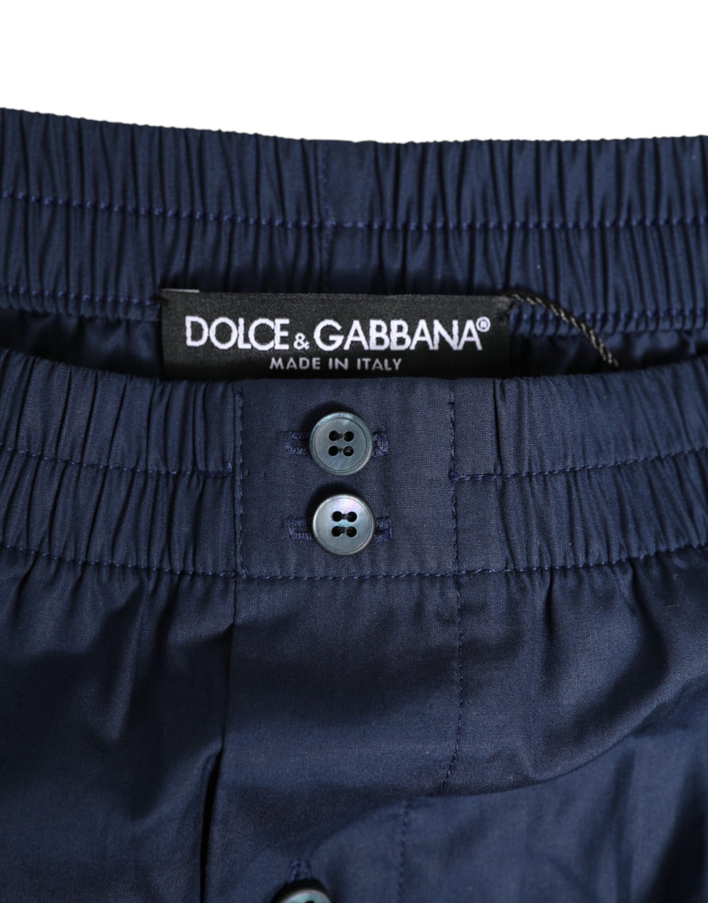 Maillot de bain Dolce & Gabbana bleu marine en coton avec taille élastique et boutons, pour un style élégant et confortable.