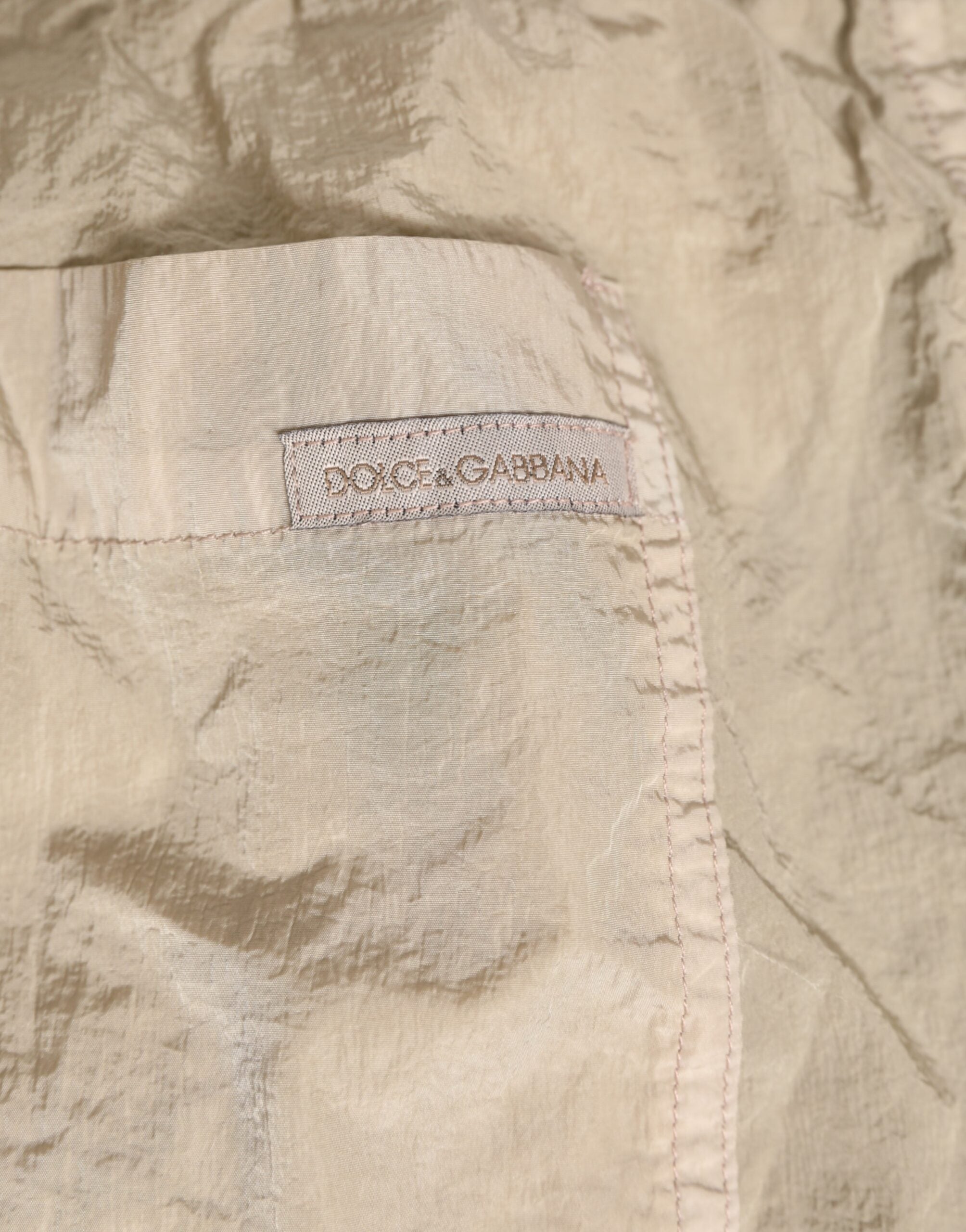 Boxers de bain hommes Dolce & Gabbana en nylon beige, maillot de plage léger et confortable pour la baignade.