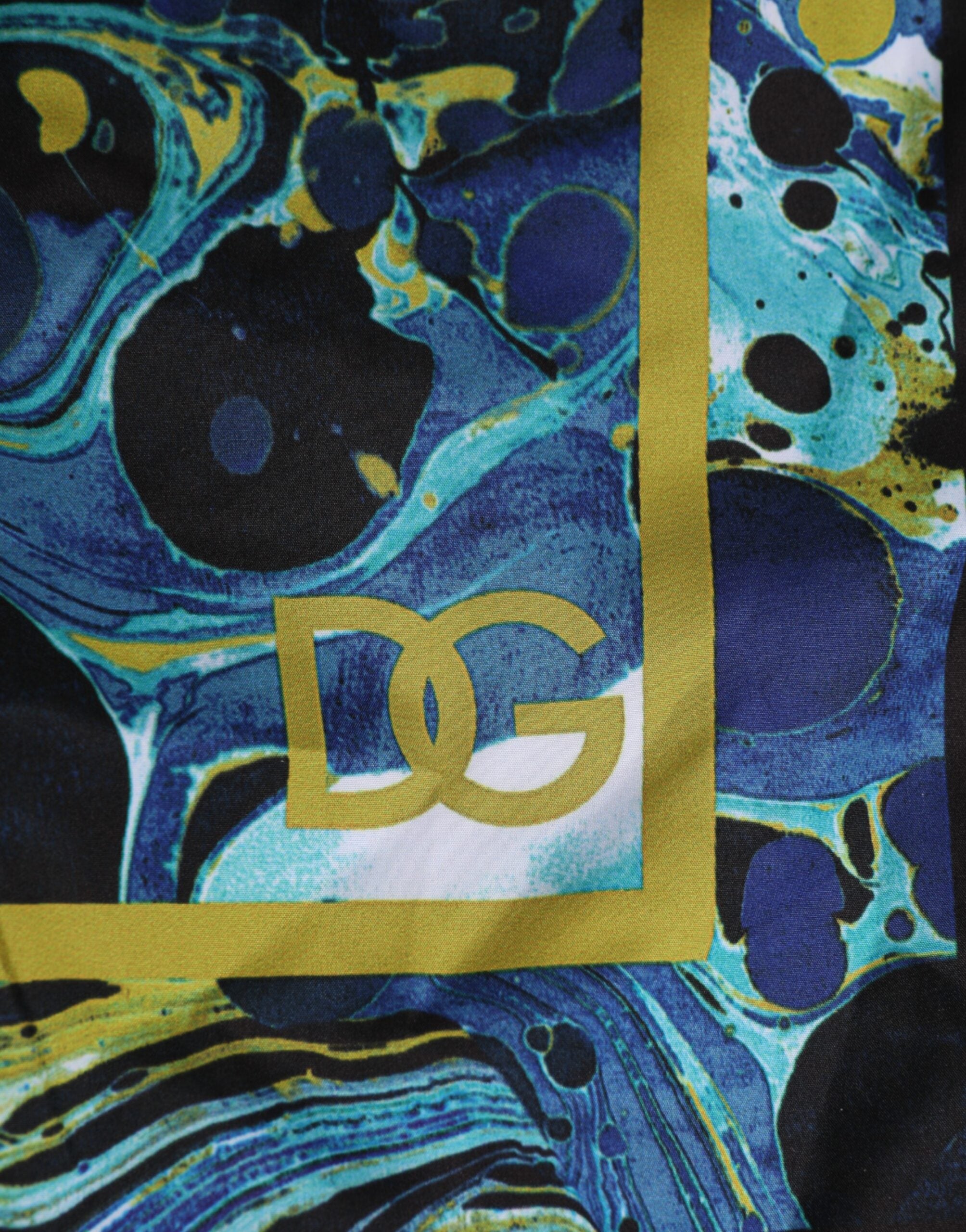 Boxers de bain pour homme Dolce & Gabbana avec motif marbre bleu et logo, tissu léger et confortable pour la plage.