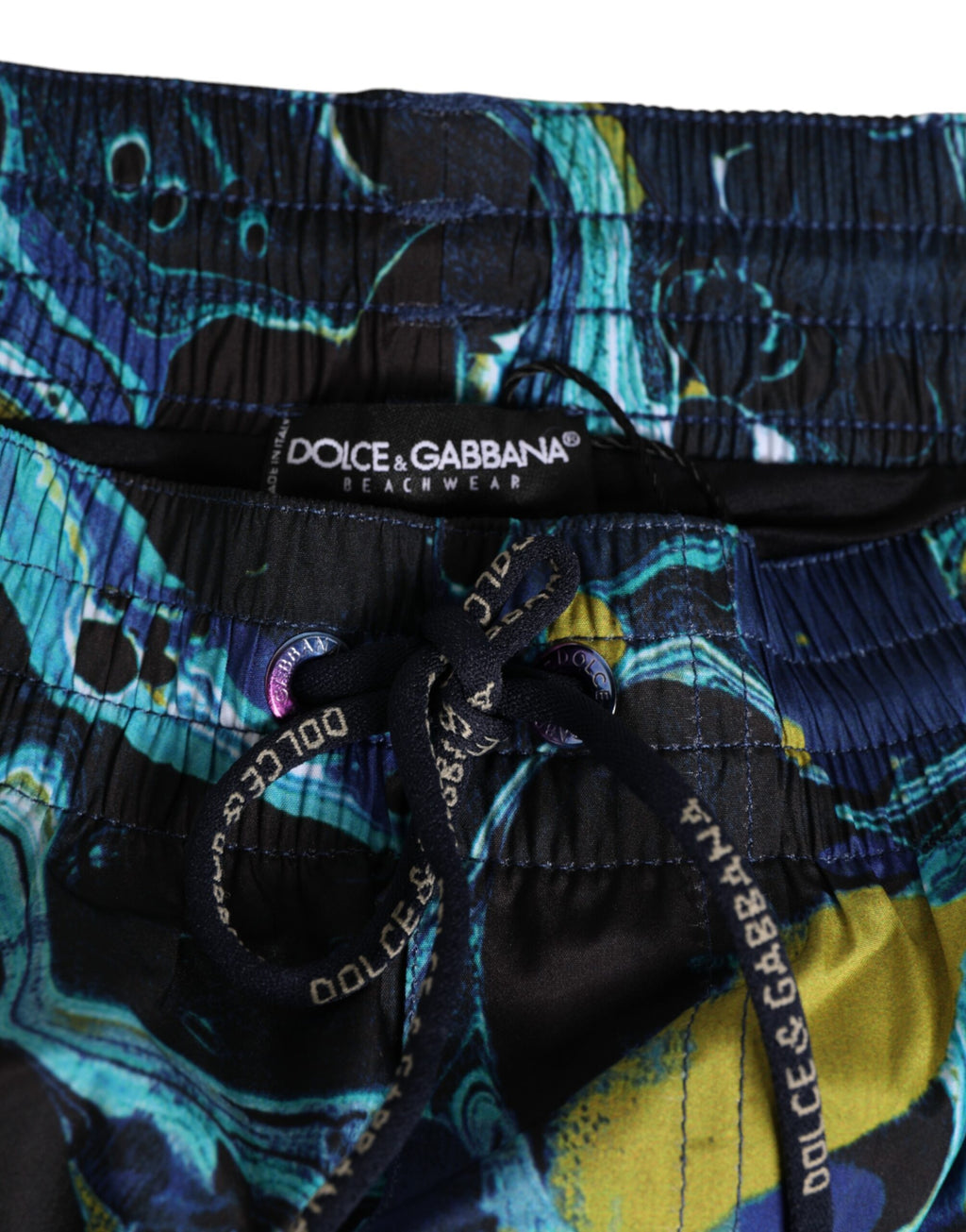 Boxers de bain homme Dolce & Gabbana avec imprimé marbre bleu et logo, tissu léger et confortable pour la plage.