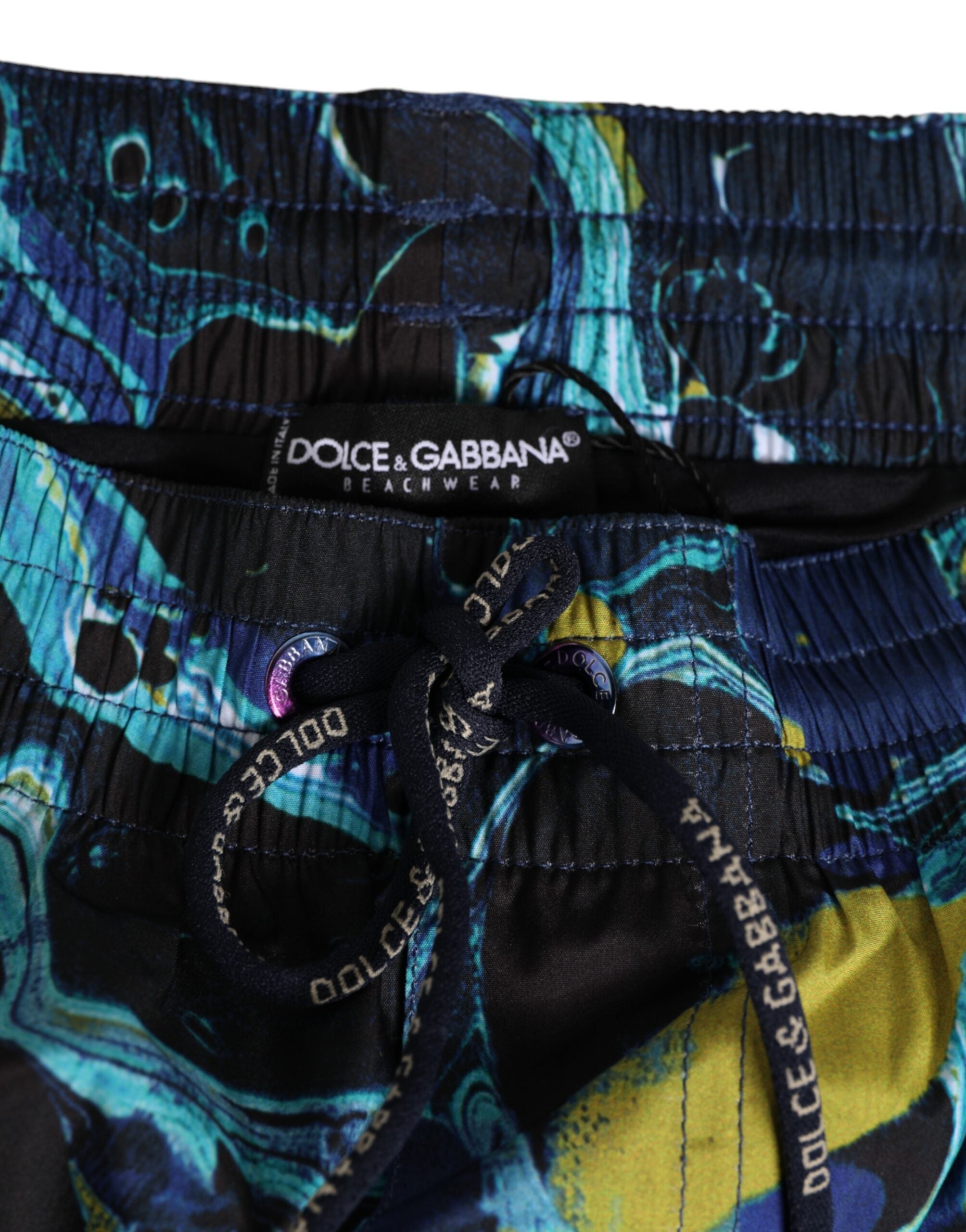 Boxers de bain homme Dolce & Gabbana avec imprimé marbre bleu et logo, tissu léger et confortable pour la plage.