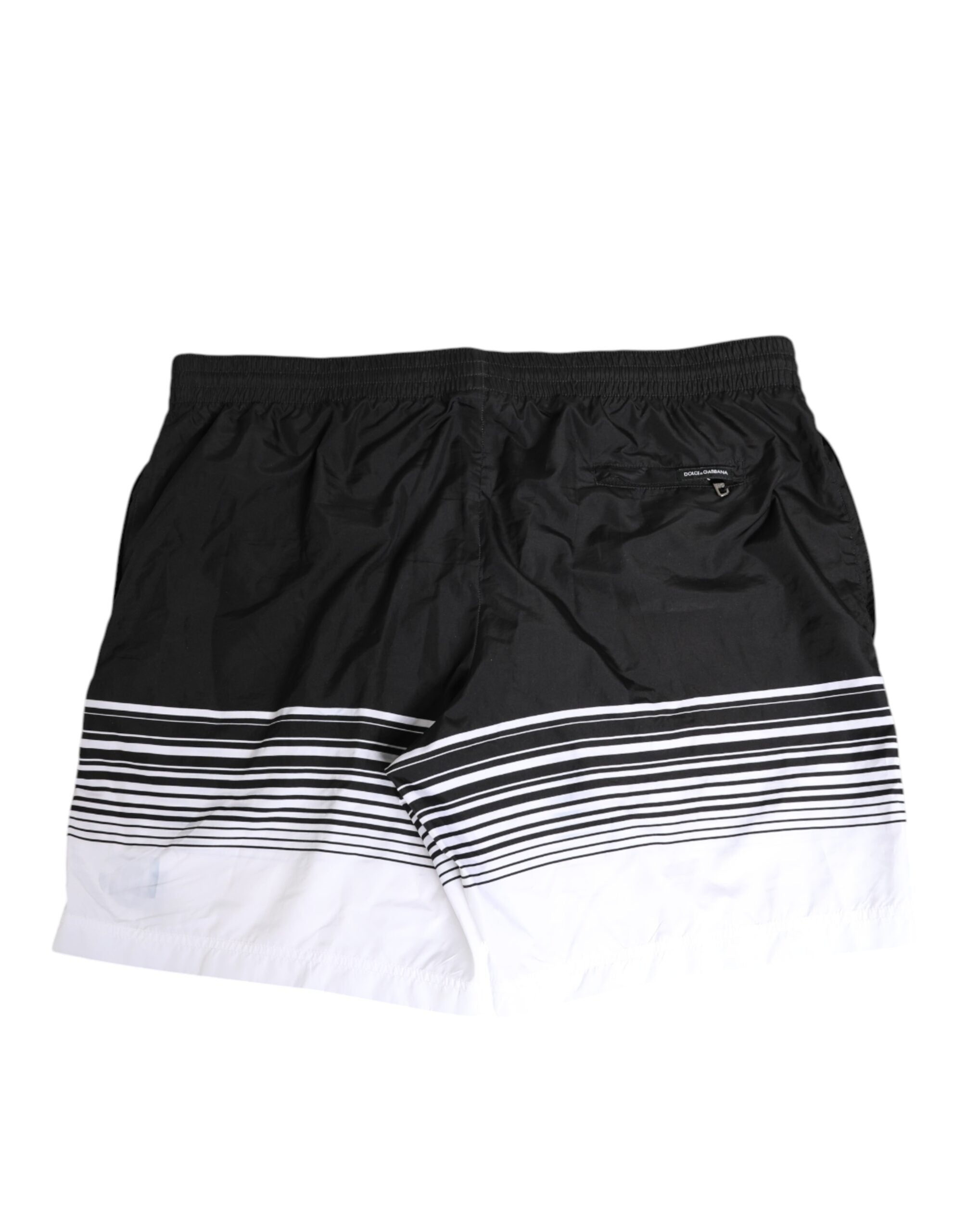 Short de bain homme Dolce & Gabbana rayé noir et blanc avec logo DG, en tissu léger et confortable.