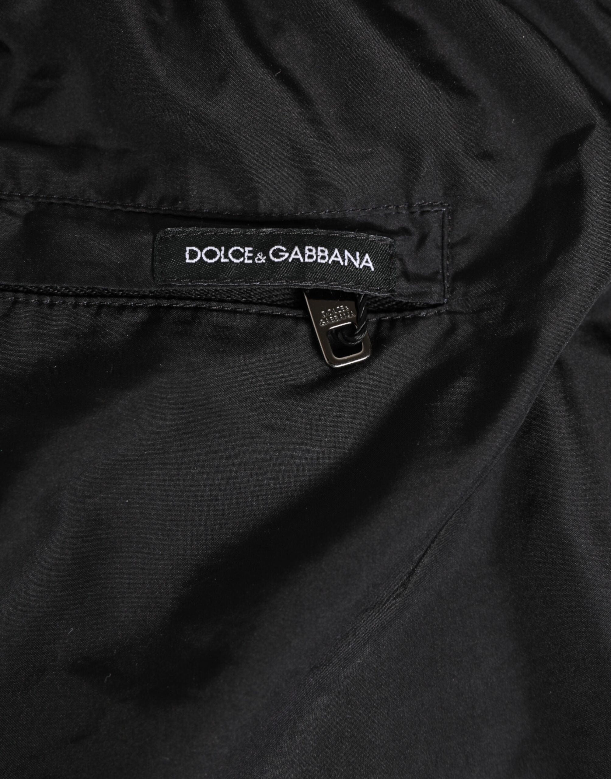 Maillot de bain homme Dolce & Gabbana noir et blanc à rayures avec logo DG, short de bain élégant.